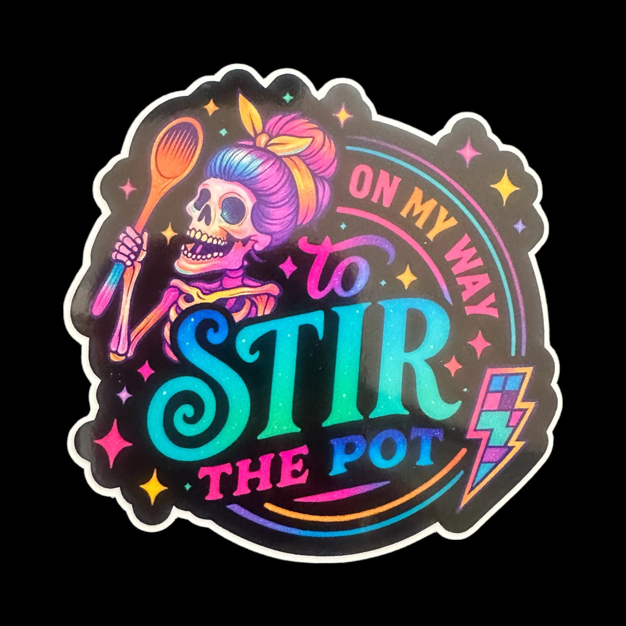Colorful sticker with a skeleton, spoon, and text 'On my way to stir the pot' on a black background